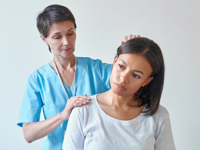 A doctor telling a patient that she requires trigger point injections for her migraines.