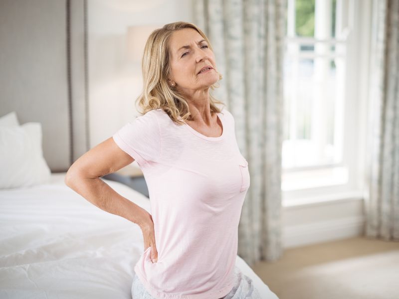 A woman experiencing vertebrogenic low back pain.