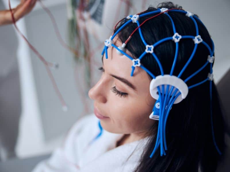 A female patient getting an electroencephalogram (EEG) test for a brain tumor diagnosis.